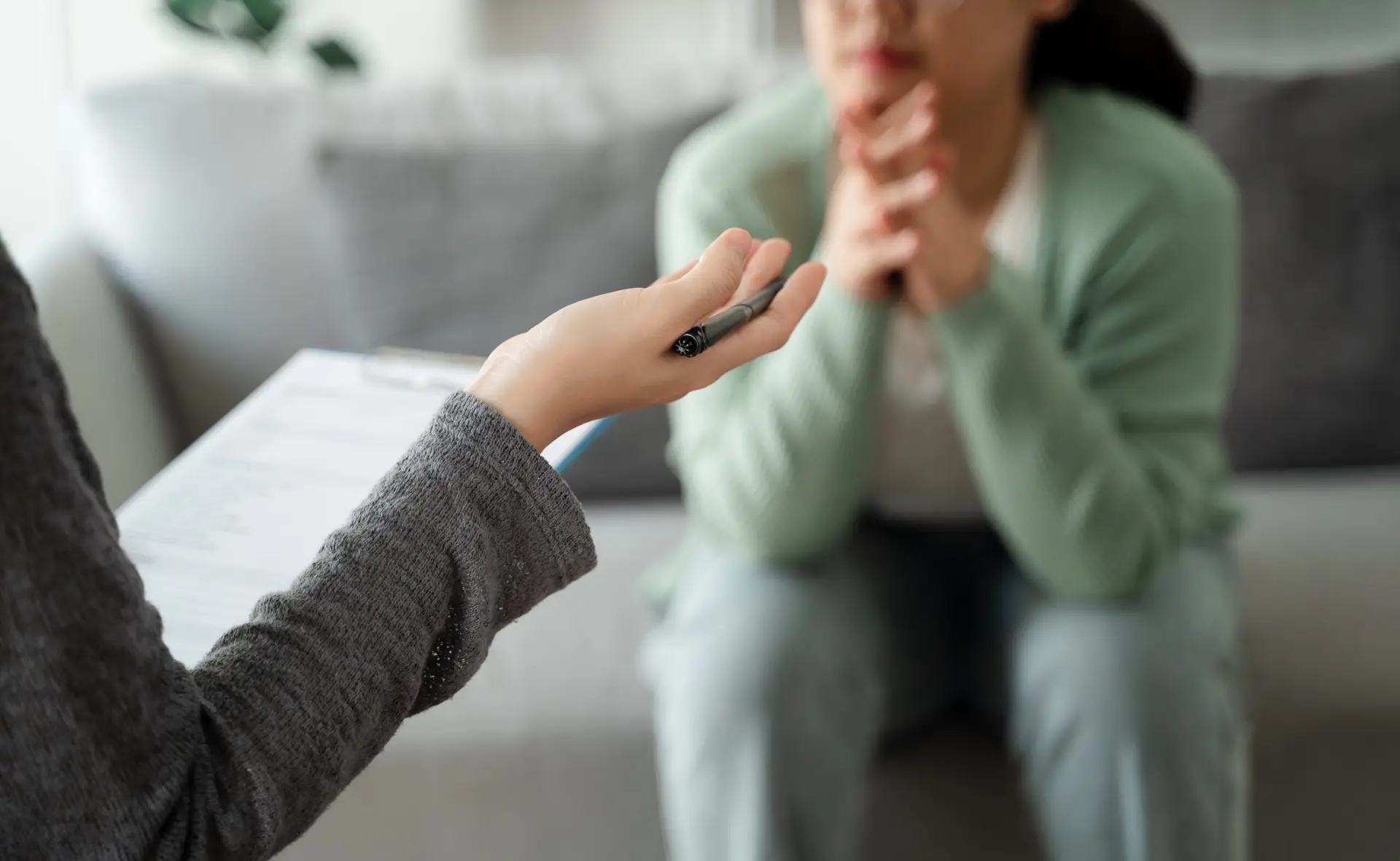 aTherapist providing trauma-informed therapy in a calm, supportive session